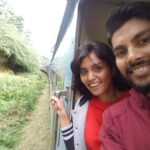 Young couple enjoying Scenic train ride in Ella Sri Lanka